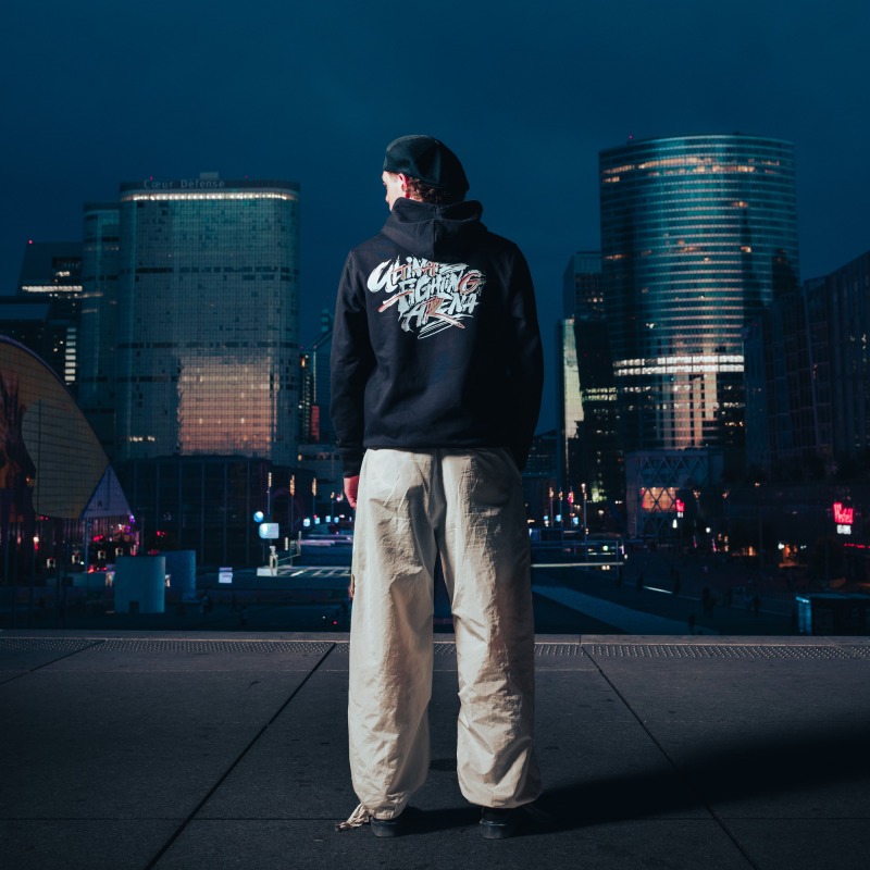 Autumn Edition Hoodie — UFA 2026, worn from behind, skyline