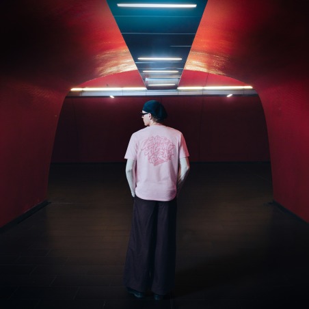 Pink Edition Tee — UFA 2026, worn from behind, tunnel