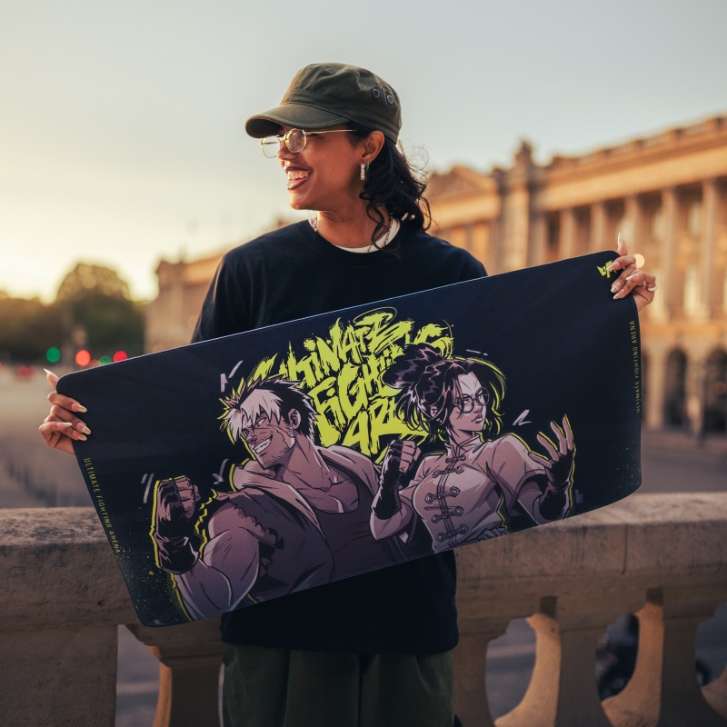 XL Deskmat — UFA 2026, held up outdoors